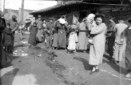 People on muddy street