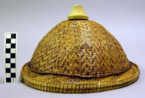 Domed woven hat with wood finial
