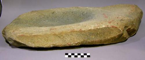 Mortar and/or metate, ground stone, slab-shaped, shallow oval depression