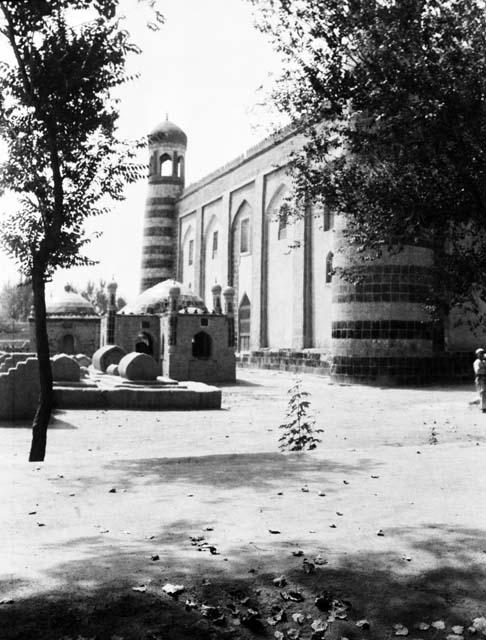 Hazrat Apak mosque, side view, cemetery and trees visible