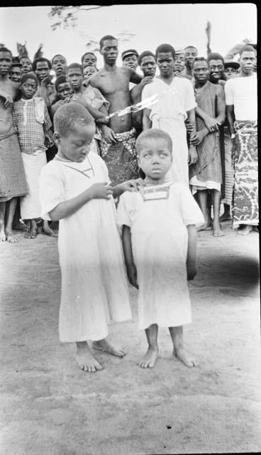 Two children in white dresses