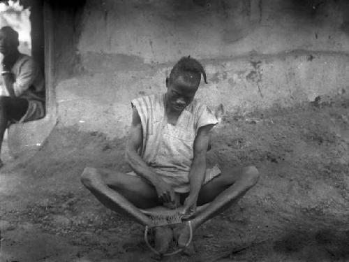 Man constructing a fishing net