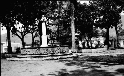 Old fountain with modern bust near la Merced Church