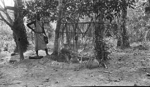 Man standing next to medicine place