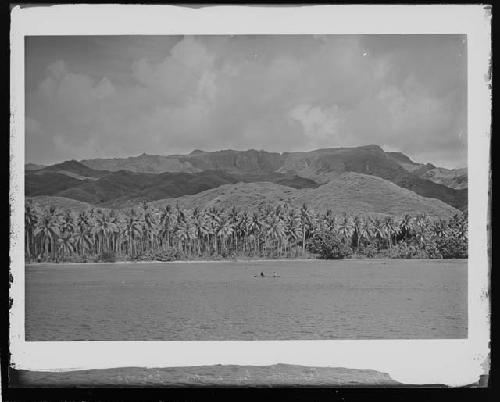 Canoe in general view of landscape and water