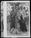 Women with tools in agricultural setting