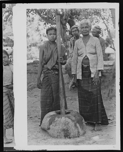 Women with tools in agricultural setting