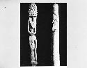 Carved ancestral figure and cylinder
