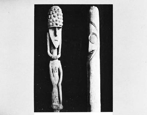 Carved ancestral figure and cylinder