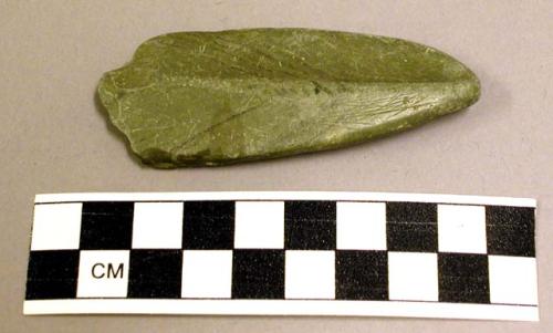 Ground stone, ornament?, tapered, broken at broad end, ridged one side