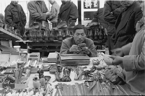 Man counting money at Pusan black market