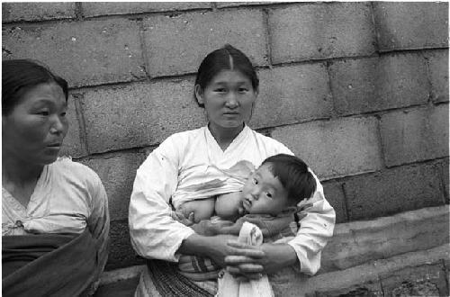 Woman breast feeding her baby