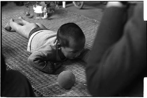 Baby lying on a rug