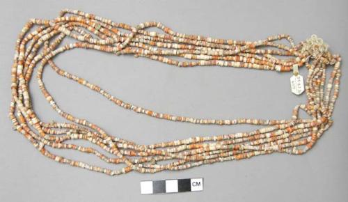 Strings of small shell beads