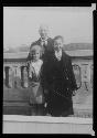 Man with two girls in front of facade; F26 / Bibb / Pace