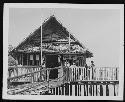 Children in front of building on water