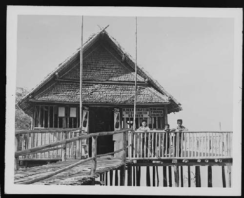 Children in front of building on water