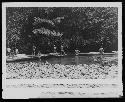 Men in Water with Boats