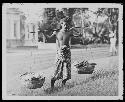 Boy carrying tools