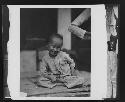 Portrait of seated child