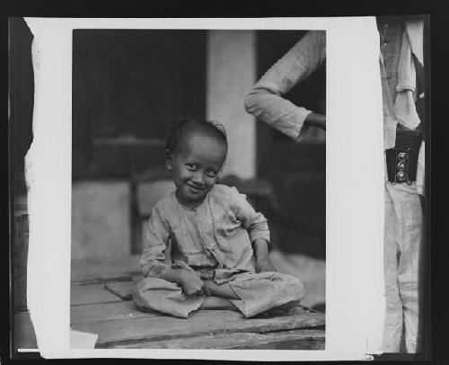 Portrait of seated child