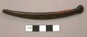 One dark, polished antler with semi-circular designs. Bone, decorated object.