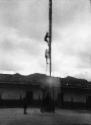 Voladores performers climbing ladder