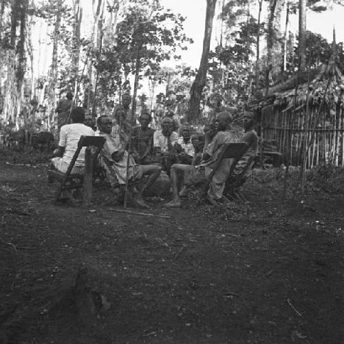 Pombe drinkers in forest clearing near Sipi camp