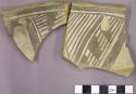 Sherds from a vessel with black on white interior geometric pattern