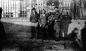 Three men standing in front of the inn