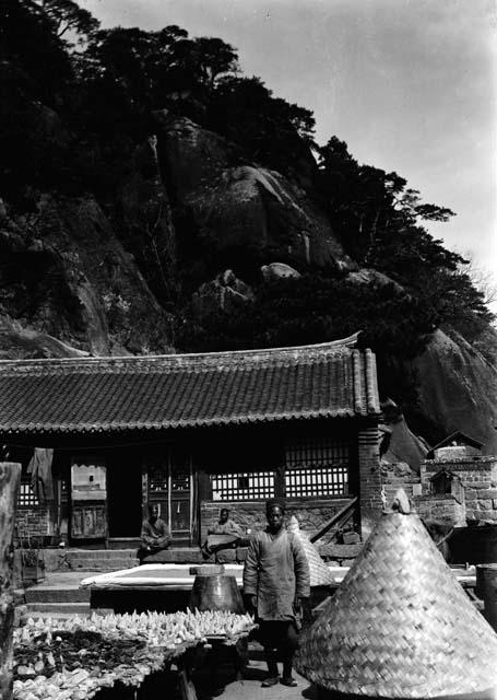 Men in front of a temple