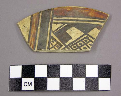 Ceramic, sherd, flat, curved edge, polychrome, designs one side