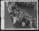 Group of people boarding boat