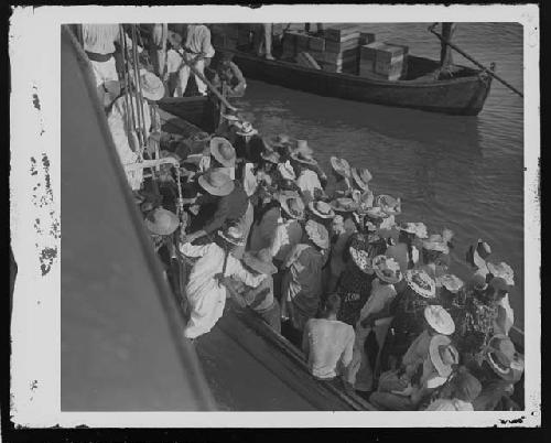 Group of people boarding boat