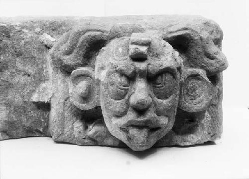 Sculptured face, tenon at side