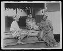 Women in front of hut