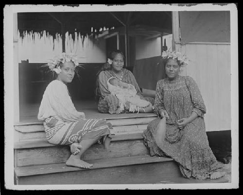 Women in front of hut