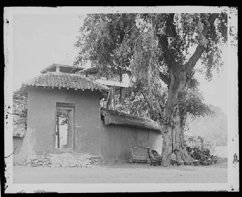 People in front of building in rural setting