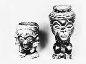 Two effigy vessels with faces