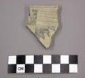 Ceramic, flat rim sherd, black designs on buff interior