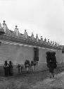 Guatemalan Indians walking by building