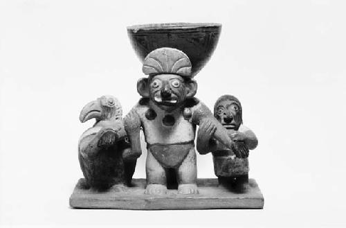 Pottery vessel showing two figures and bird