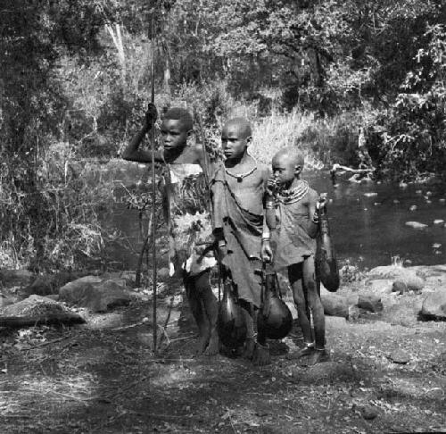 Children who come daily to fill gourds at the stream