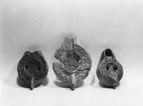 Roman stamp and two Roman lamps