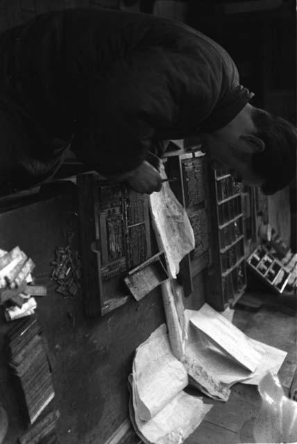 Chinese typesetter in newspaper office