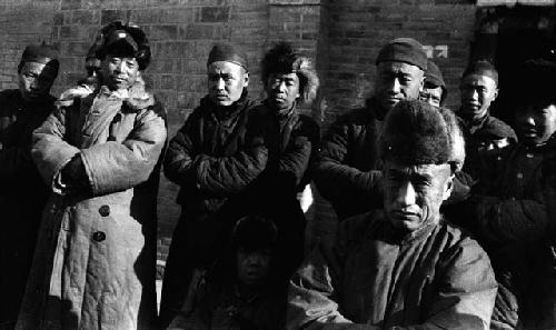 Group of men in front of building