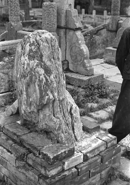 Stone in brick pedestal in foreground