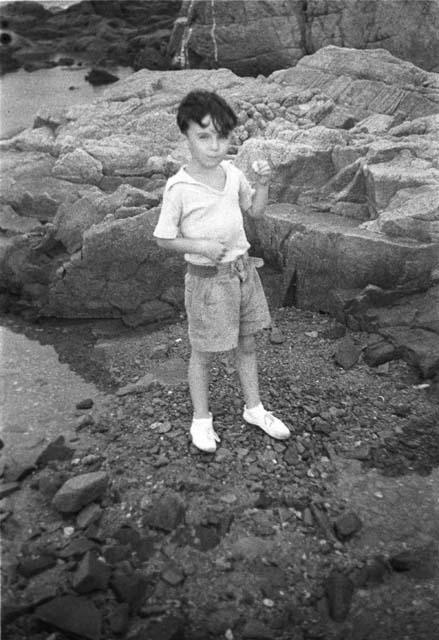 David Lattimore standing on rock near water