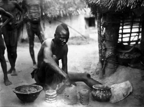 Man making anklet molds