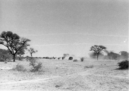 Distant view of trucks traveling in a line

